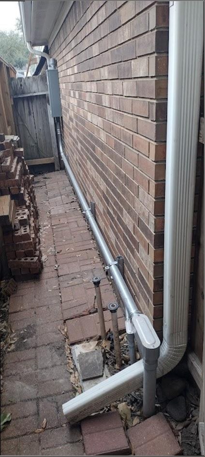 Exterior conduit run on residential brick wall